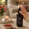 AromaHoliday Bloom Pink Pepper & Rose room spray being used in a luxury living space with roses and pink pepper accents.