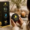 Woman holding an AromaHoliday Bangkok Spice travel-inspired candle beside the Spice of Life luxury candle gift set in a stylish modern home.