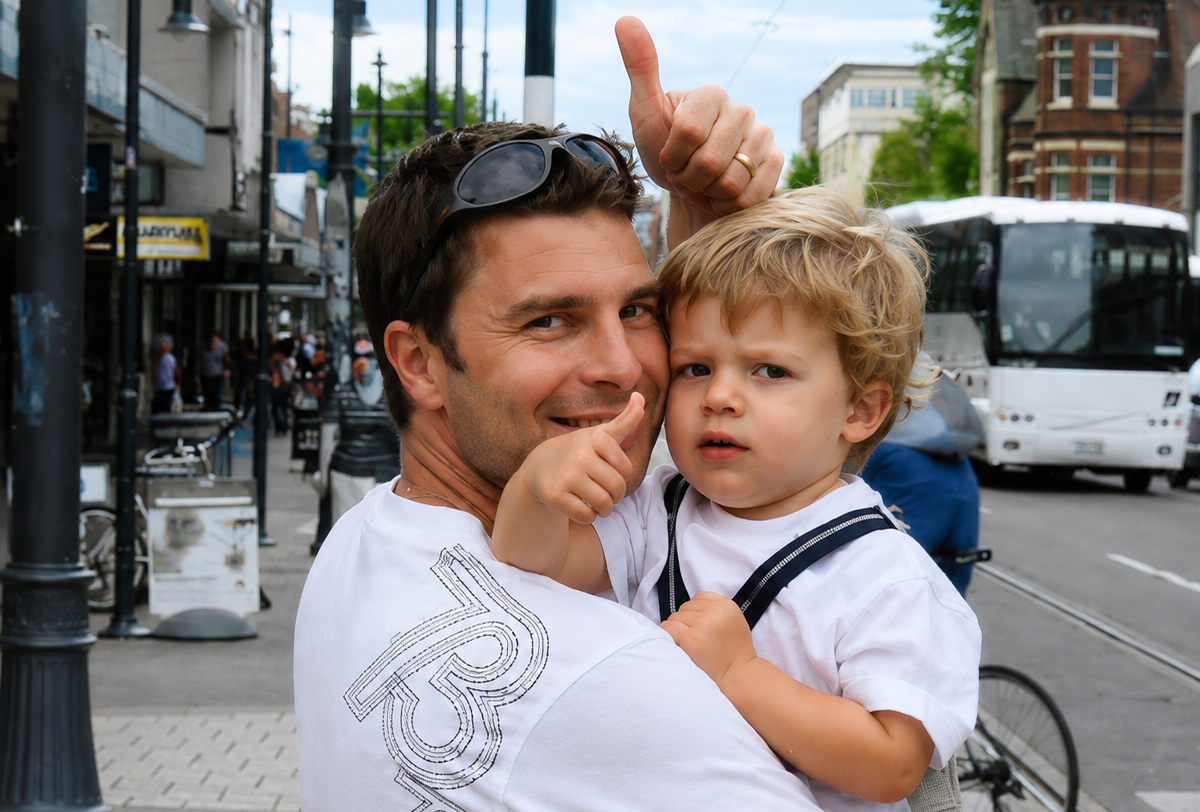 Young Mark Jordan holding his young son Max during their world travels — a special memory that inspired the AromaHoliday journey. Captured in a vibrant city setting, this image represents travel, family, adventure, and the emotional connection between scent and memory.