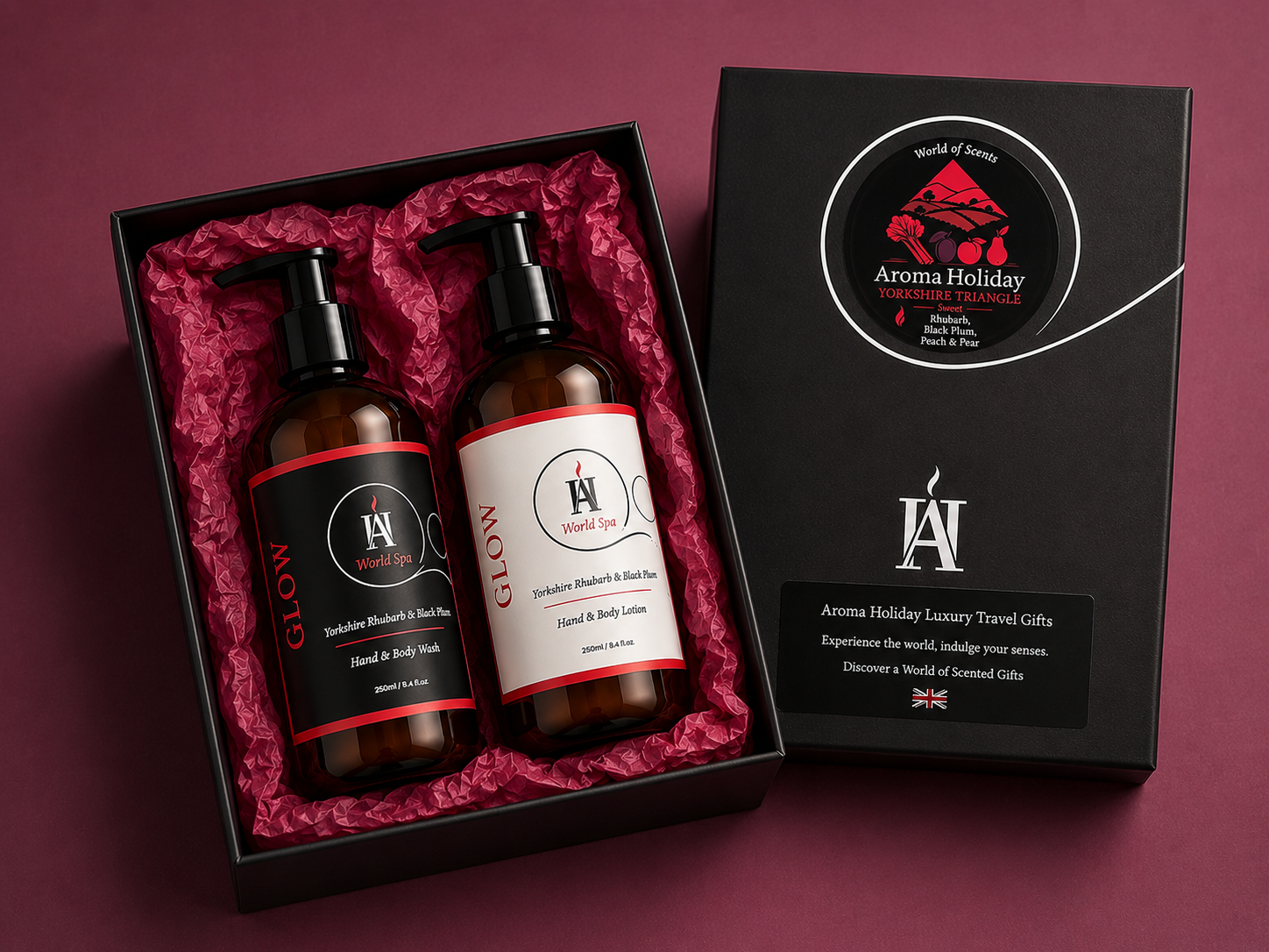 AromaHoliday World Spa Glow luxury gift set featuring Yorkshire Rhubarb and Black Plum hand wash and body lotion in a premium black gift box with rich ruby tissue paper.