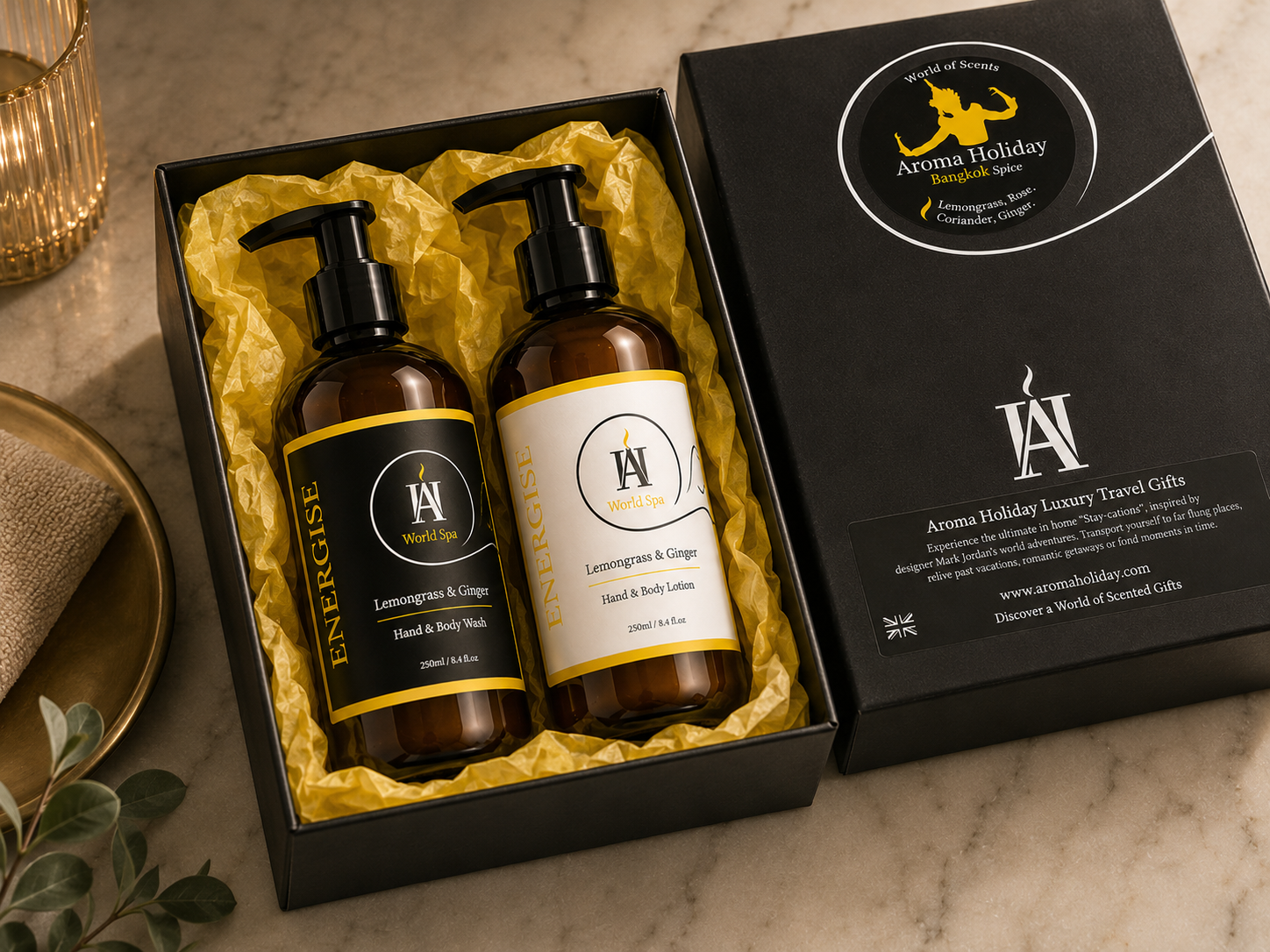 AromaHoliday World Spa Energise luxury gift set featuring Lemongrass & Ginger hand wash and body lotion presented inside a premium black gift box with vibrant yellow tissue paper.